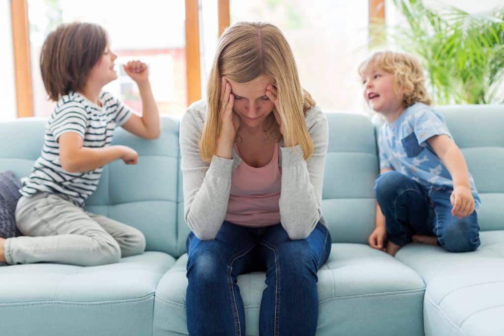 mom has negative thoughts with kids not listening in the background